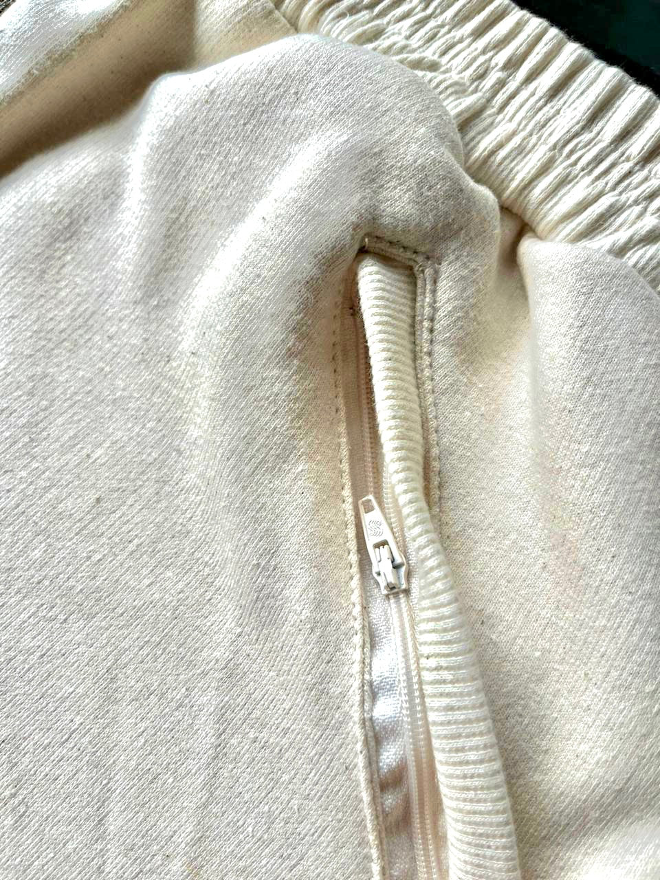 side zipper pockets in a oatmeal colour
